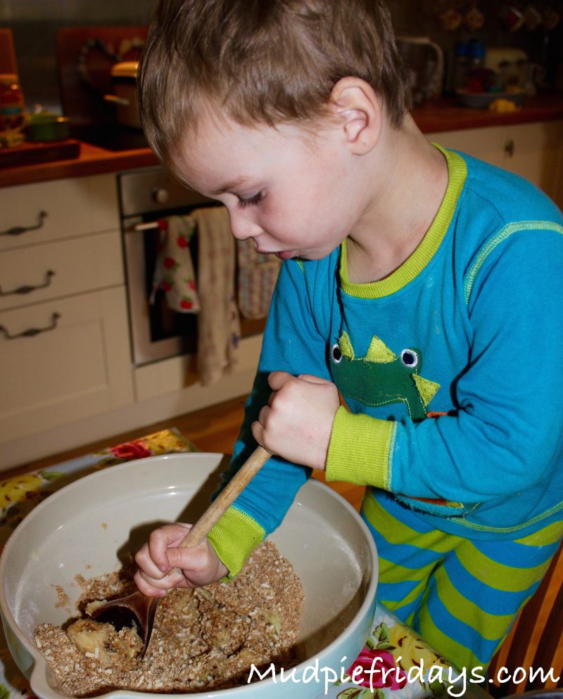 Charlie making the Christmas cake one of our christmas traditions with kids