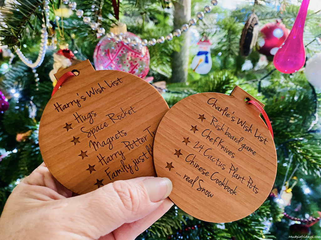 Christmas decorations showing the boys wish lists for Christmas each year