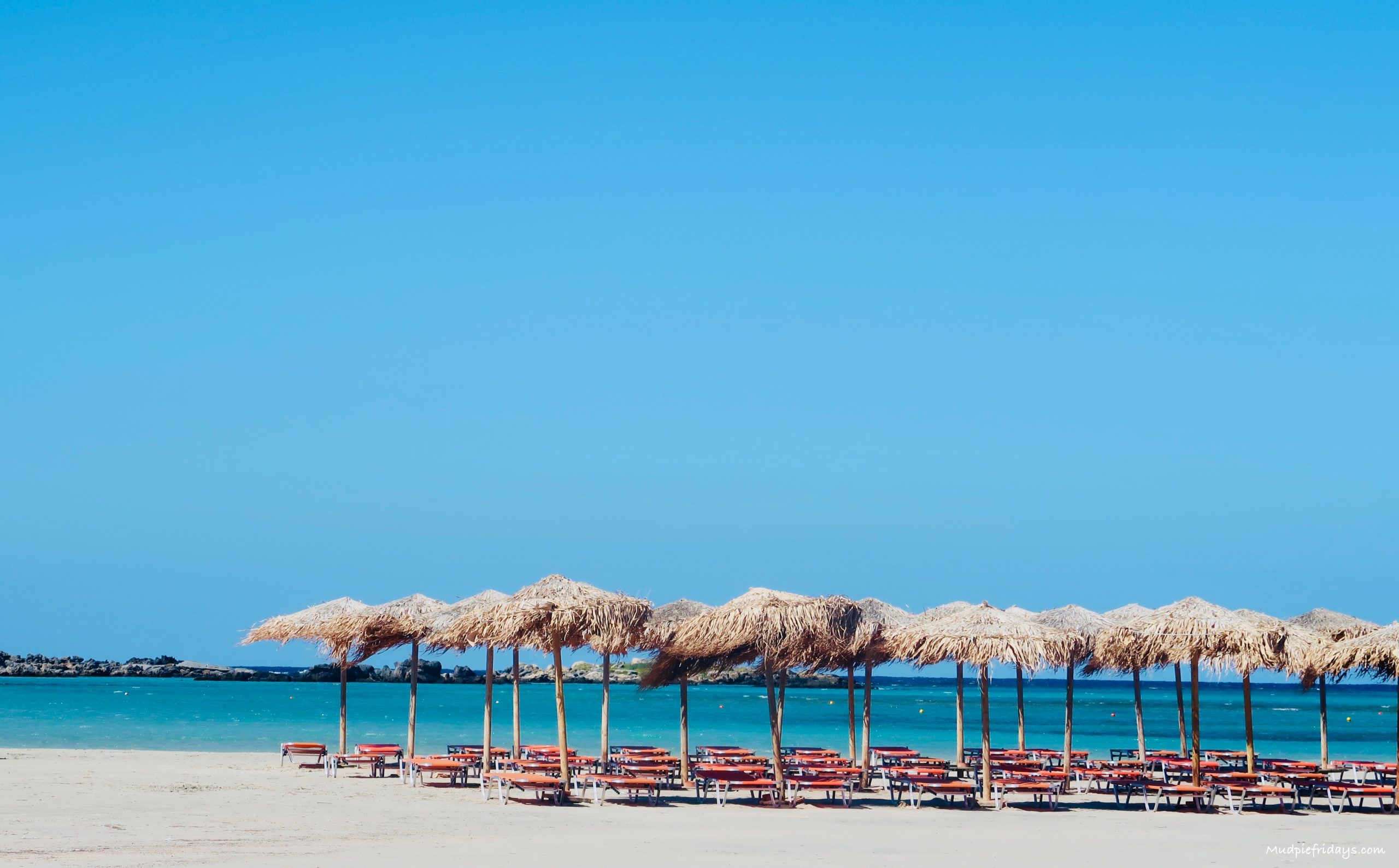 sun beds and parasols on Elafonisi beach crete to hire - the best beaches in crete