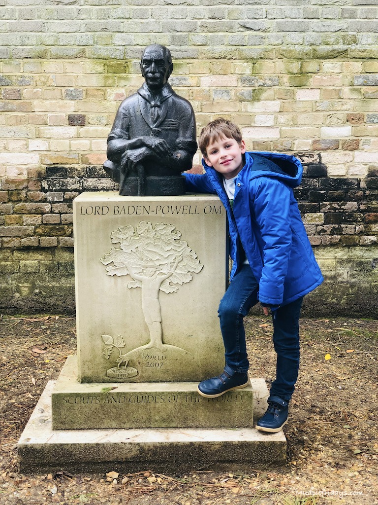 Charlie with a statue of Lord Baden-Powell on Brownsea island the home to the scout movement