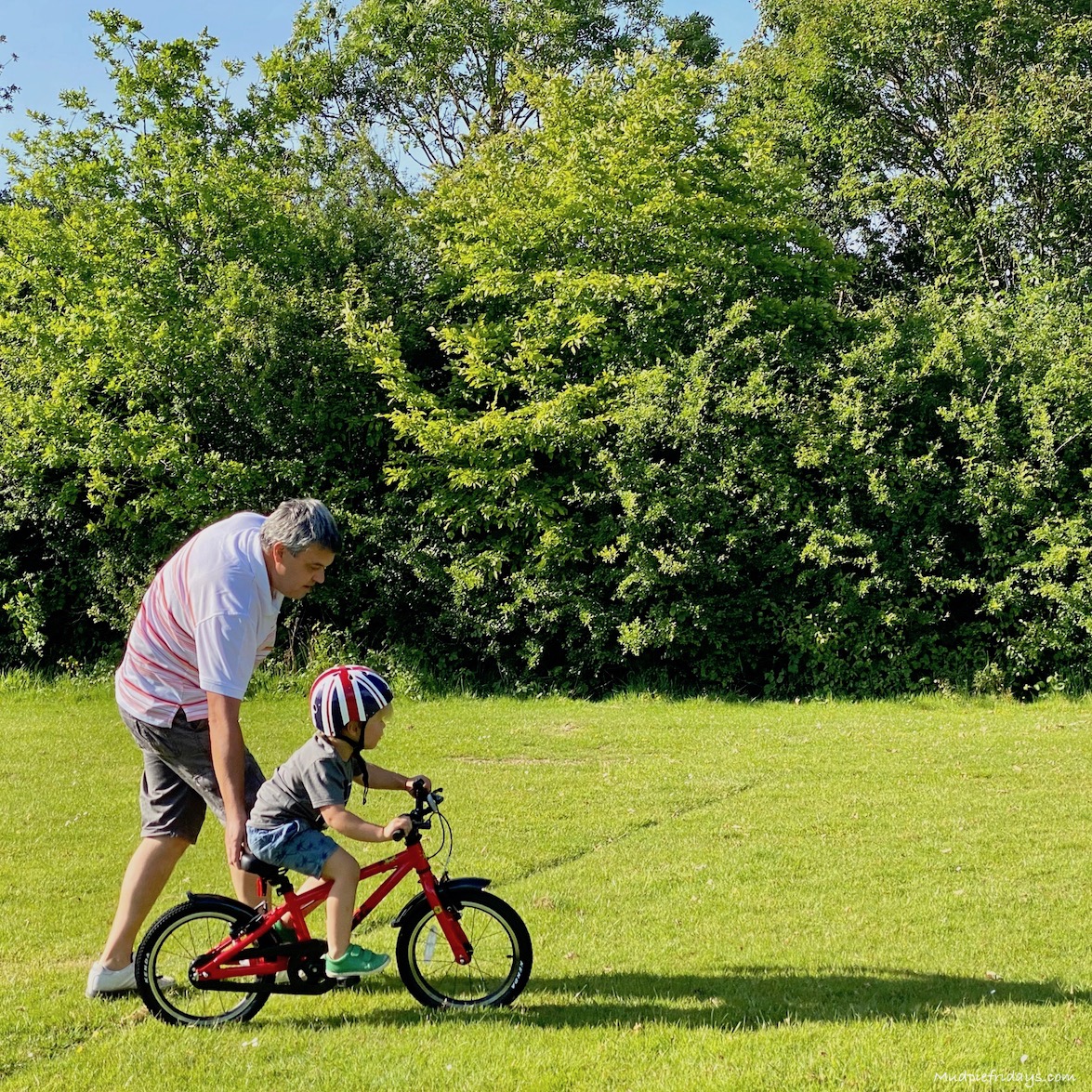 harry learning to ride his new frog bicycle