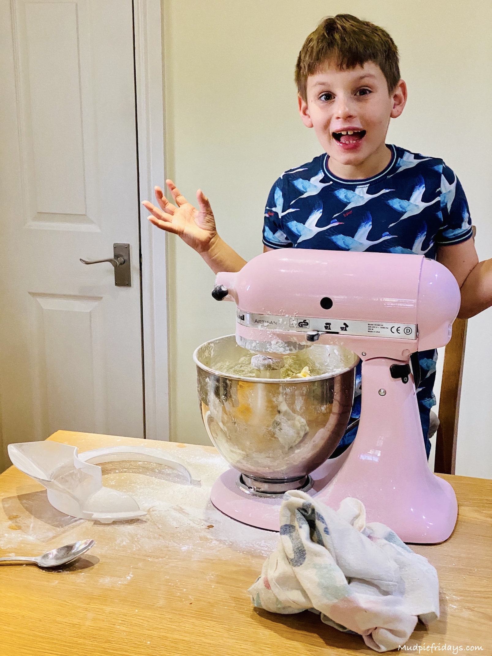 Charlie covering the kitchen in icing sugar