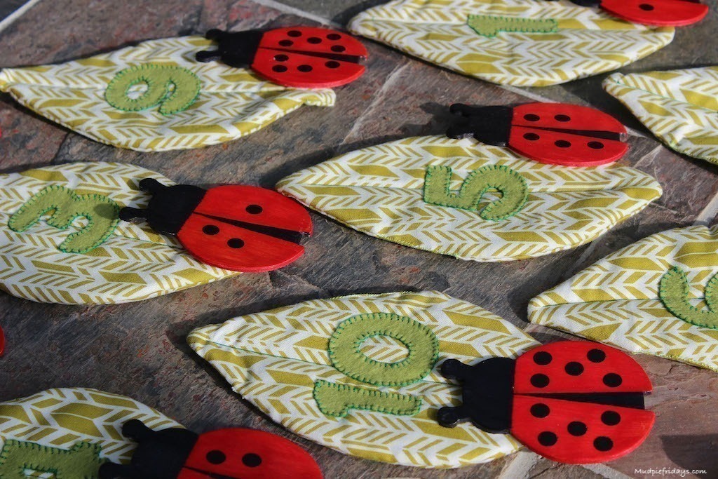 Ladybird Number Match Game DIY with wooden ladybirds and sewn numbered leaves