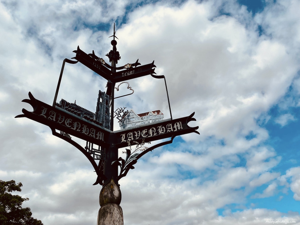 Town Sign. Definitely worth a look at the three-sided town sign that depicts The Guildhall, The Church of St Peter & St Paul and also an American airbase from WWII