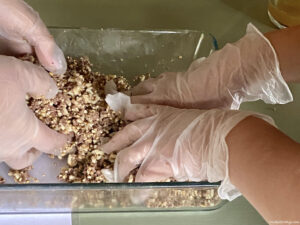 mixing by hand the Haggis mixture while taking a haggis cooking class in Scotland