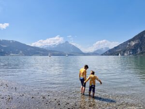 Paddling in the lake at Lake Thun, Manor Farm Campsite, Interlaken Switzerland