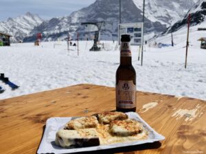 A drink and cheese on toast at the top of Mannlichen