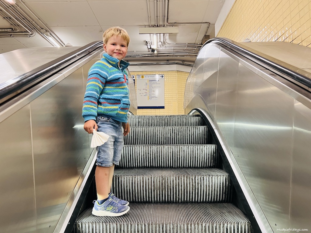 Harry on the Paris metro escalator on our paris city break - family trip to paris