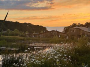 Sunset the view across the lake from our veranda in our VIP Cottage at Les Villages Nature Paris