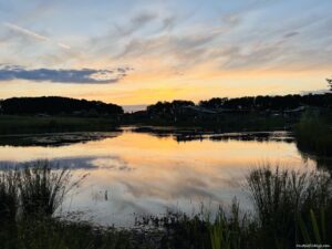 Sunset over the lake at our cottage in Center Parcs Paris