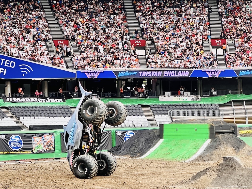 magaladon balancing on two wheels at the monster jam
