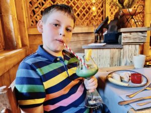 Charlie having a mocktail at dinner