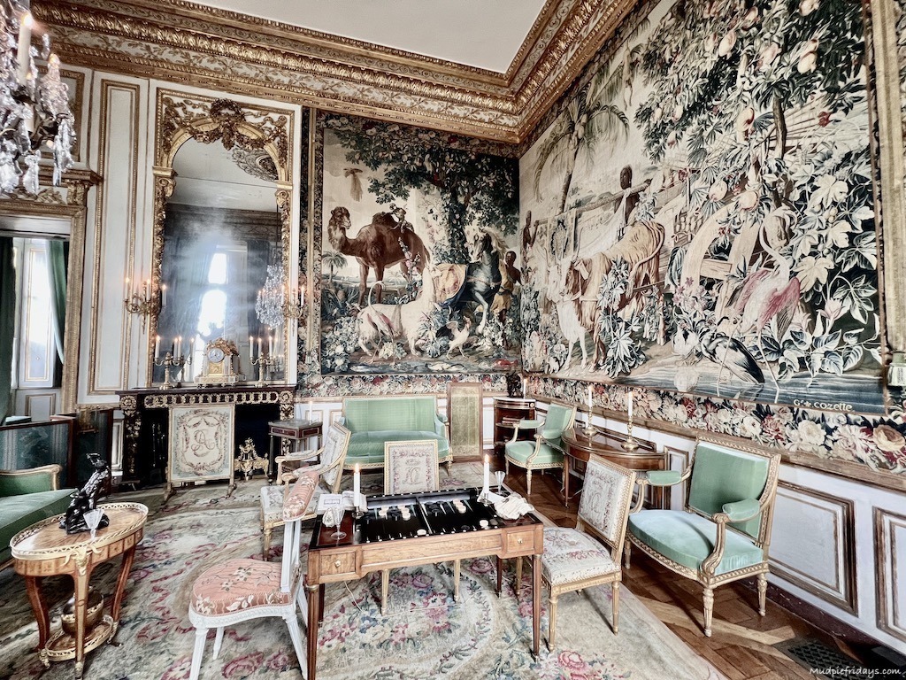 The wall hangings in the game room French tapestry