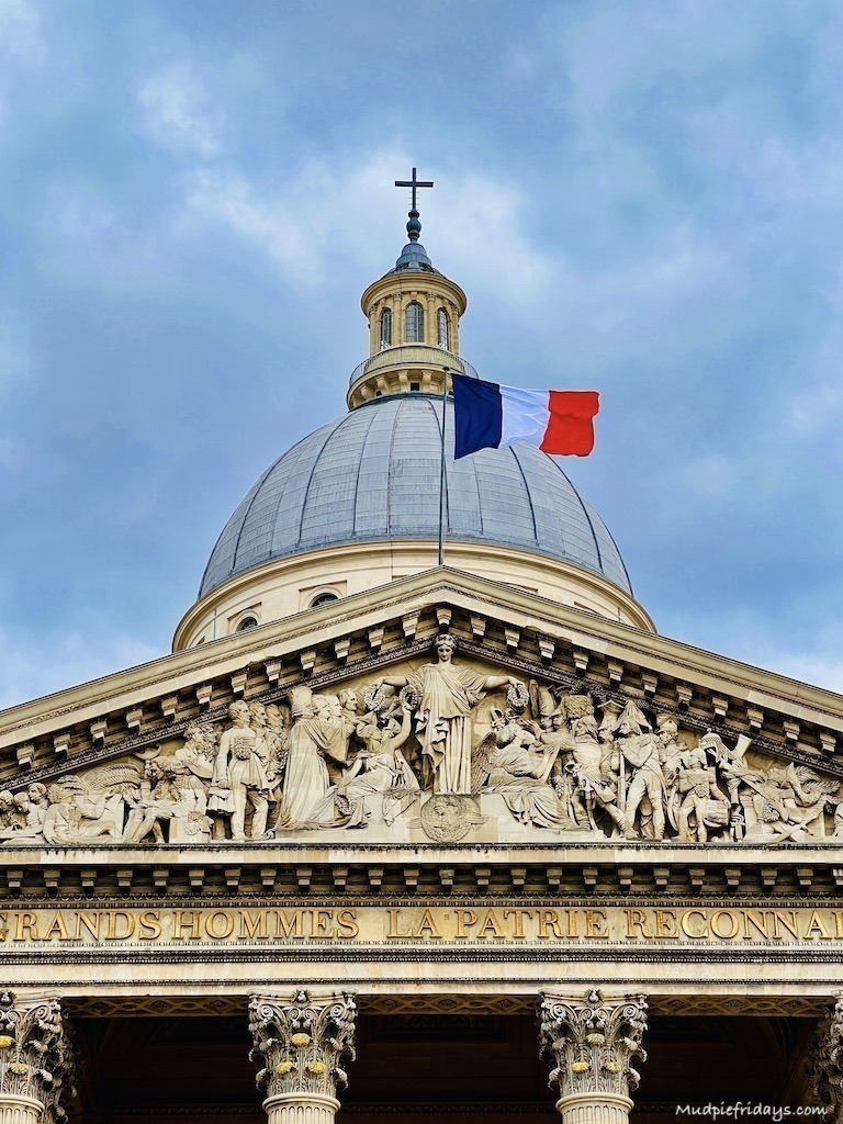 The french flag flying in front of the Pantheon Paris