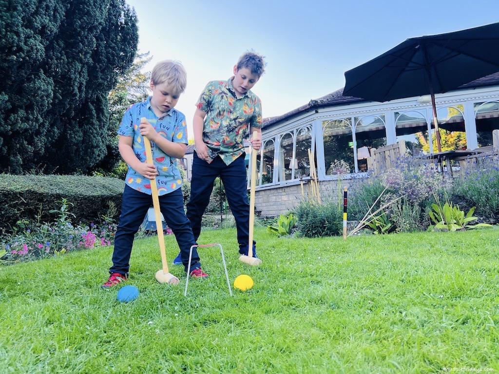 The boys trying croquet for the first time