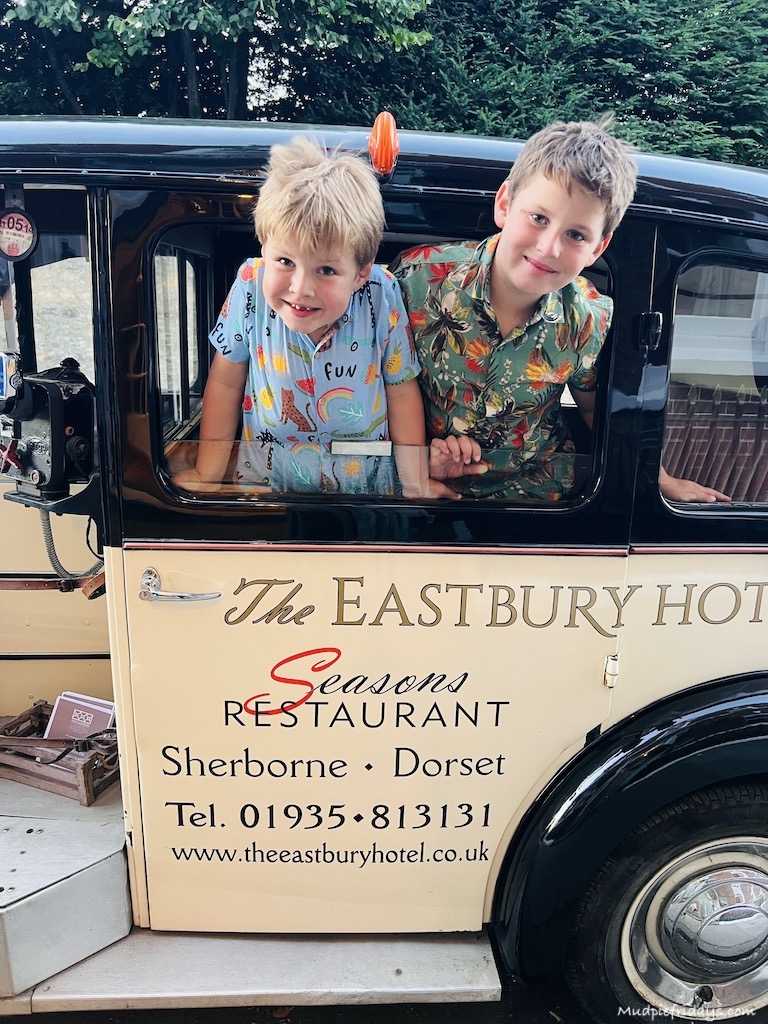 The boys enjoying the car outside The Eastbury Hotel