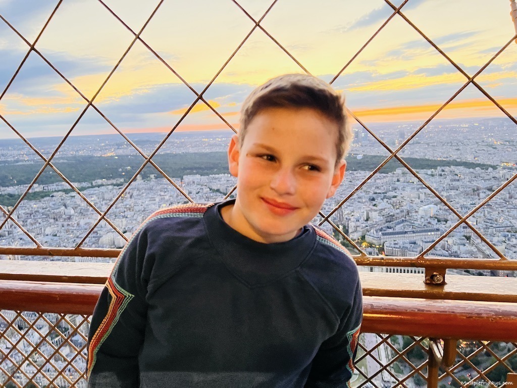 Charlie at the top of the Eiffel Tower with kids