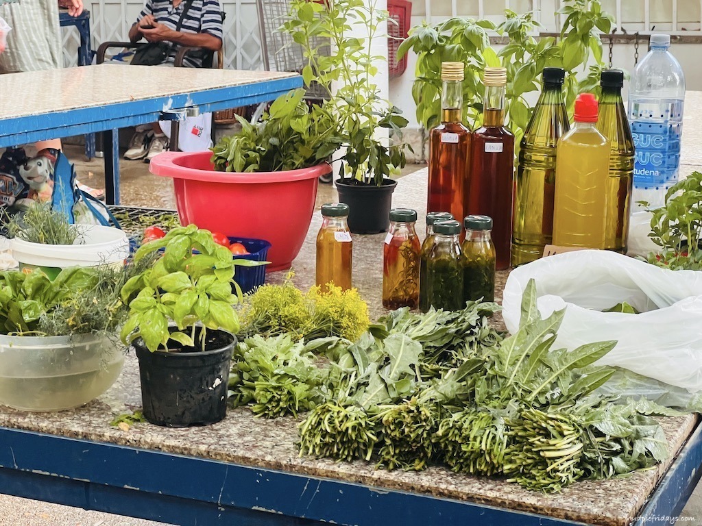 Herbs and olive oil for sale at Green Market Split