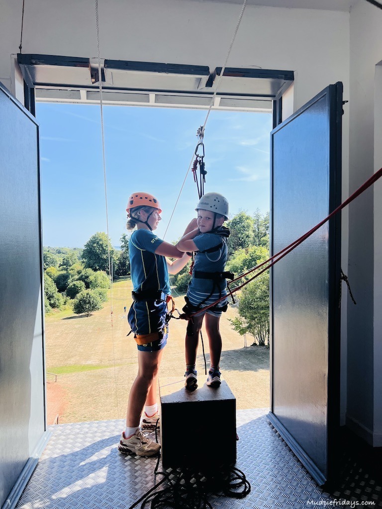The boys trying out zip lining for the first time