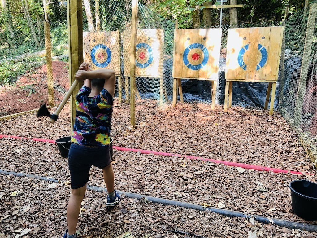 Charlie trying axe throwing at PGL Family Holidays on our pgl family adventures