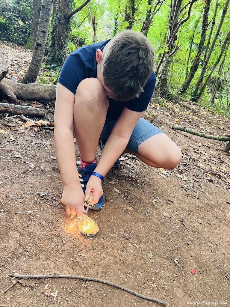 lighting fire during the survivor session at PGL Holidays