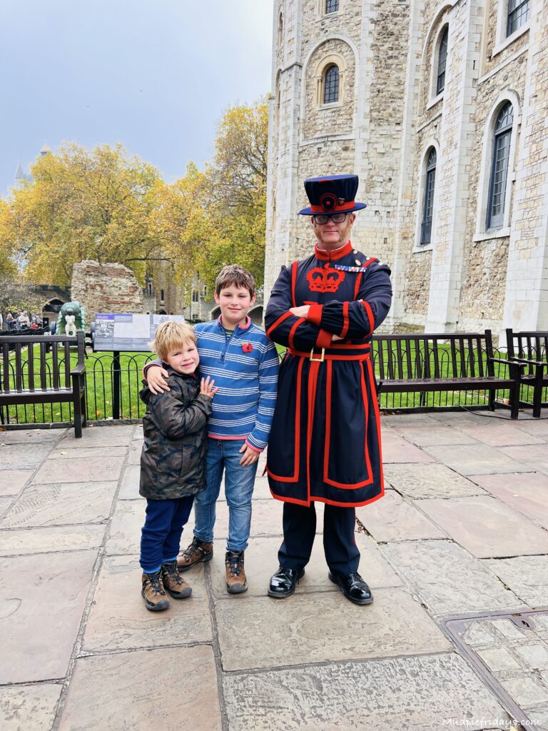 The boys with a Yeoman Warder at the Tower of London