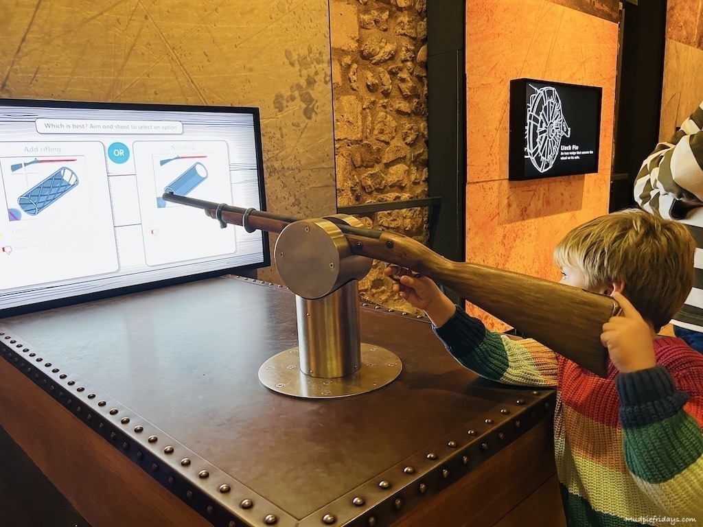 Harry learning how to shoot a riffel - Tower of London with kids