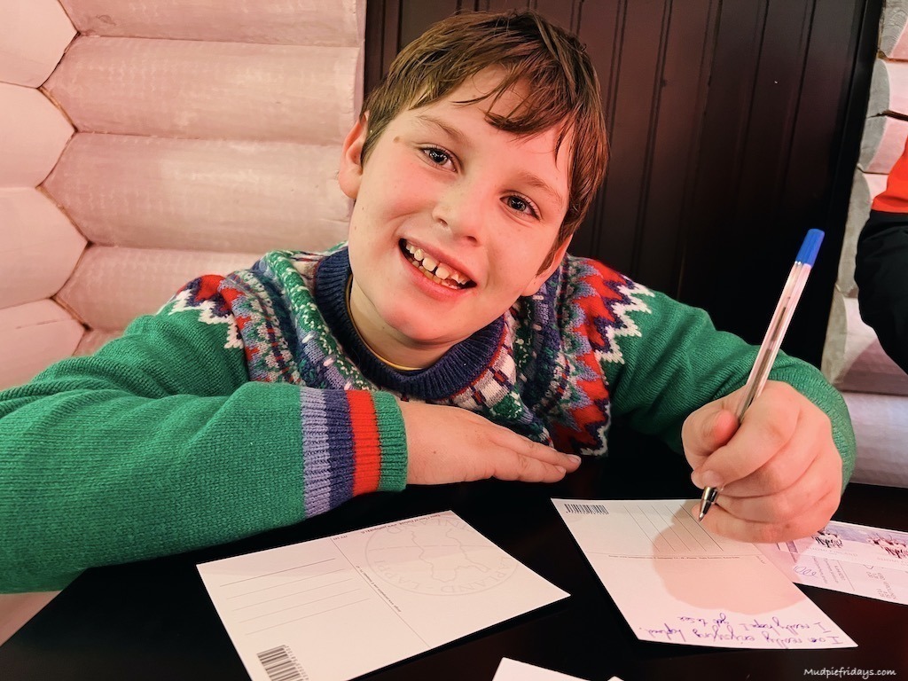 Charlie writing postcards to send home