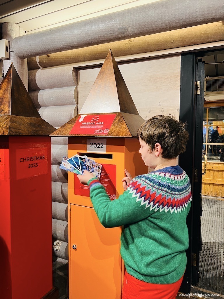 Charlie posting postcards at the north pole / arctic circle in Finland