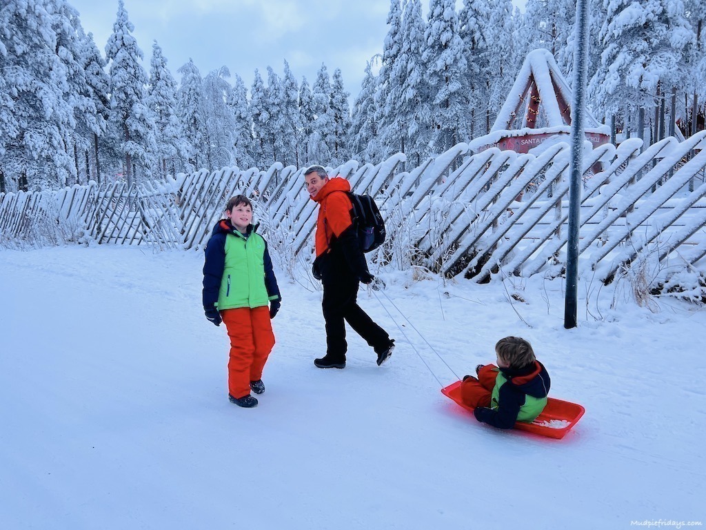 Harry being pulled along in a sledge while at Santas Village in Finland
