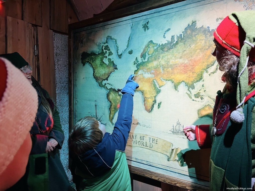 Inside the elf command center at Rovaniemi Lapland looking at the map