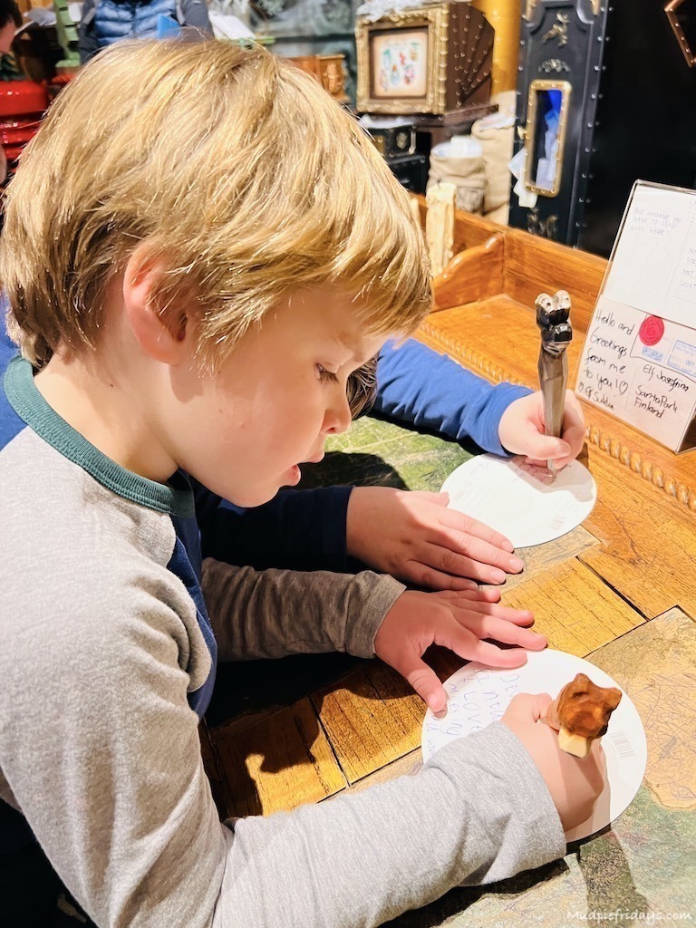 Harry writing a post card at the post office