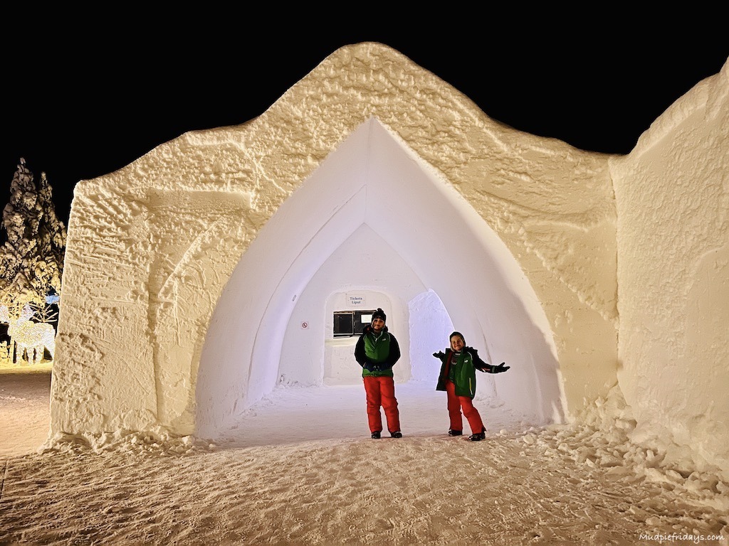 The boys standing outside the front entrance of the ice hotel in Rovaniemi