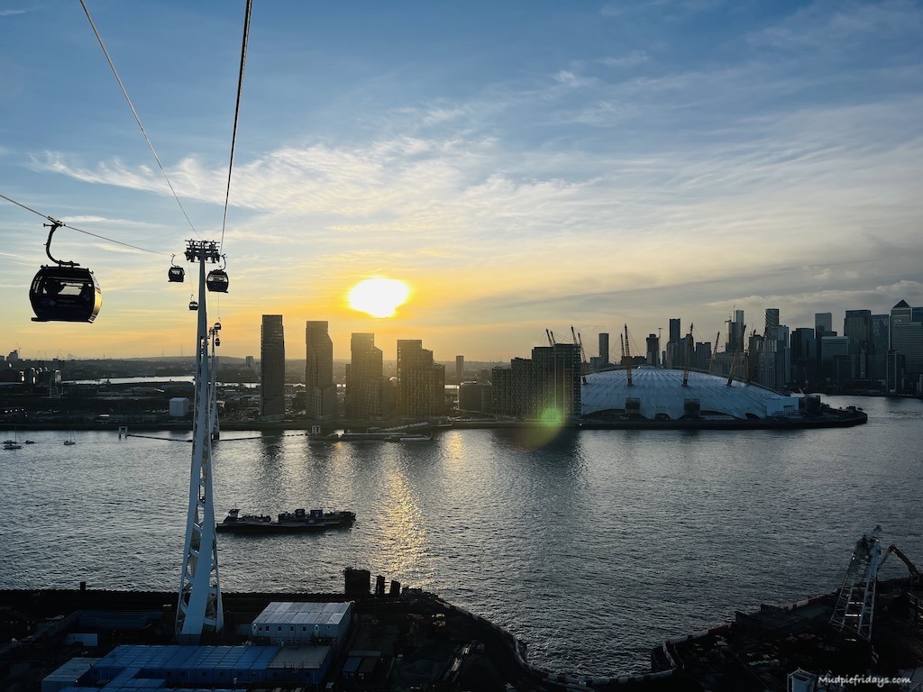 The sun setting from the o2 cable car over the London skyline
