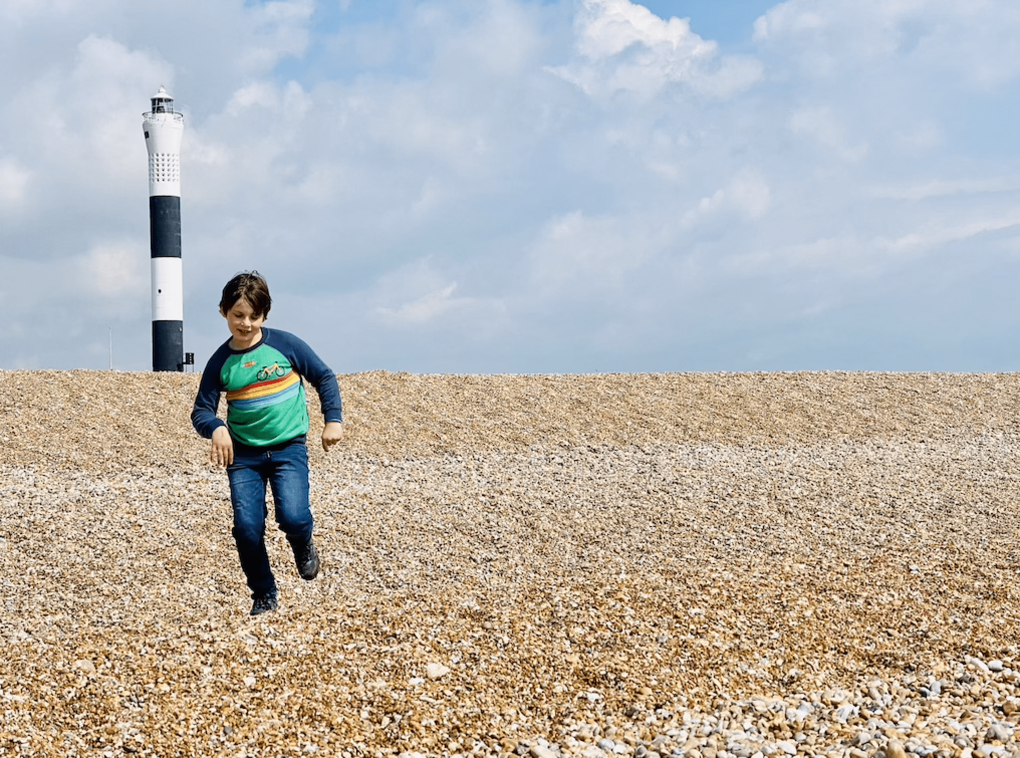 Charlie running down the beach at Romney Marsh
