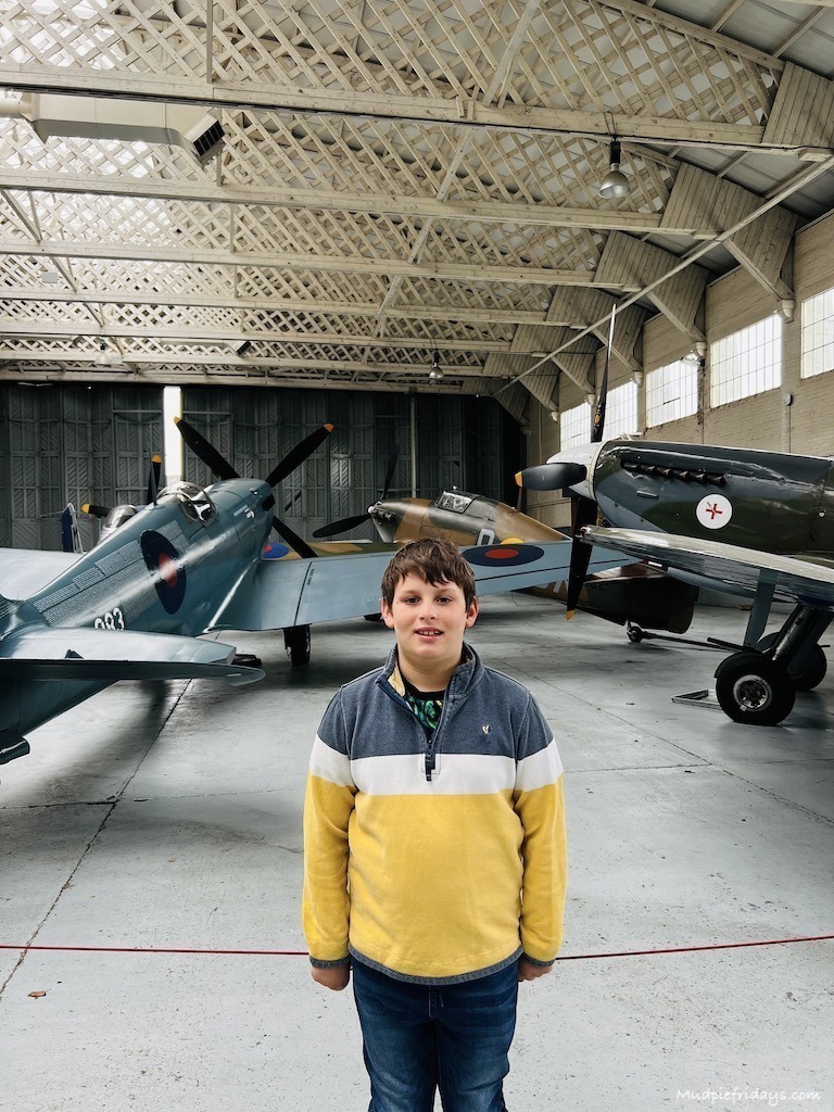 Charlie in front of the spitfires at Duxford air museum