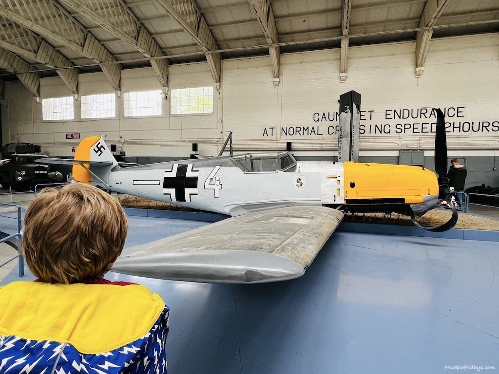 Harry looking at the planes in the battle of Britain hanger