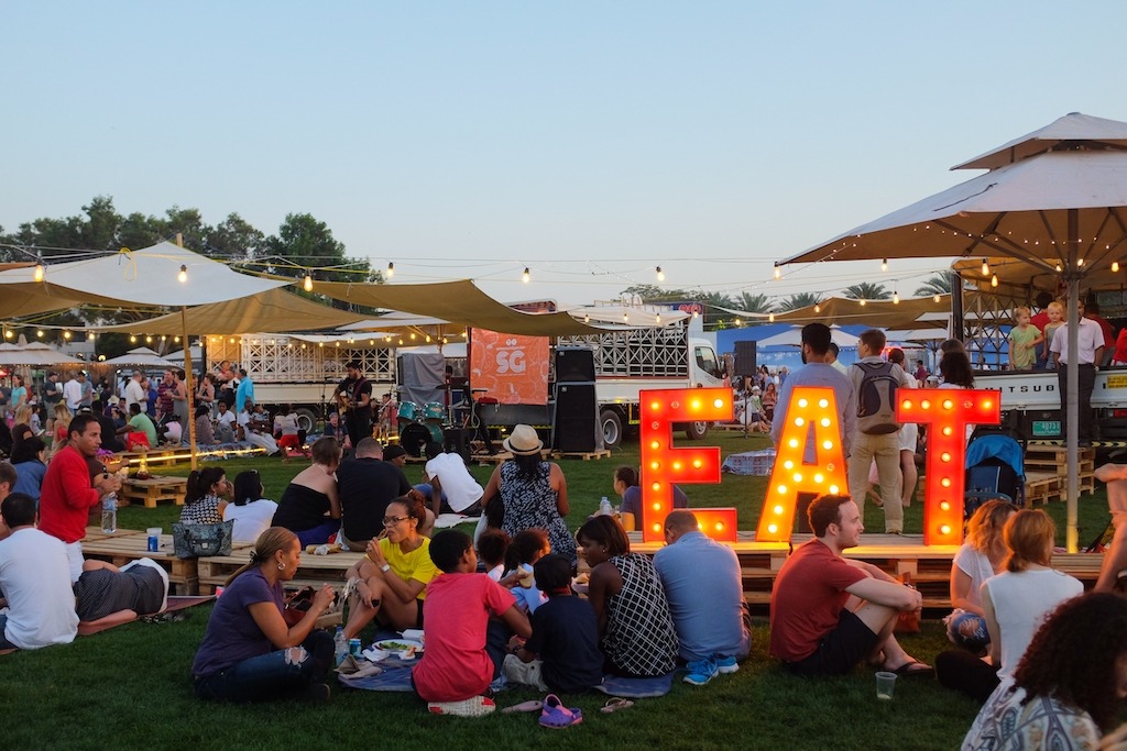 Family festivals 2023 - group of people gathered for food.