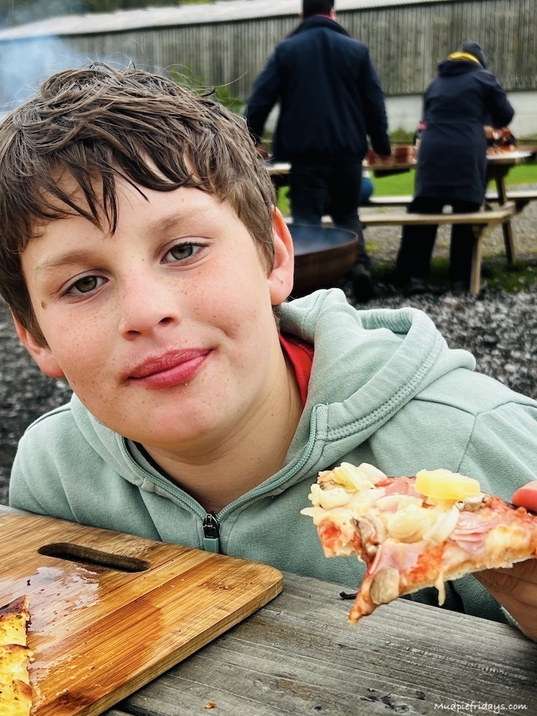 Charlie eating his pizza
