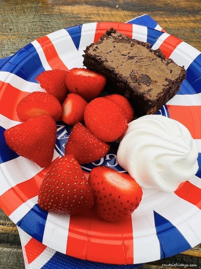 strawberries, mergine and brownie on a union jack paper plate for the coronation