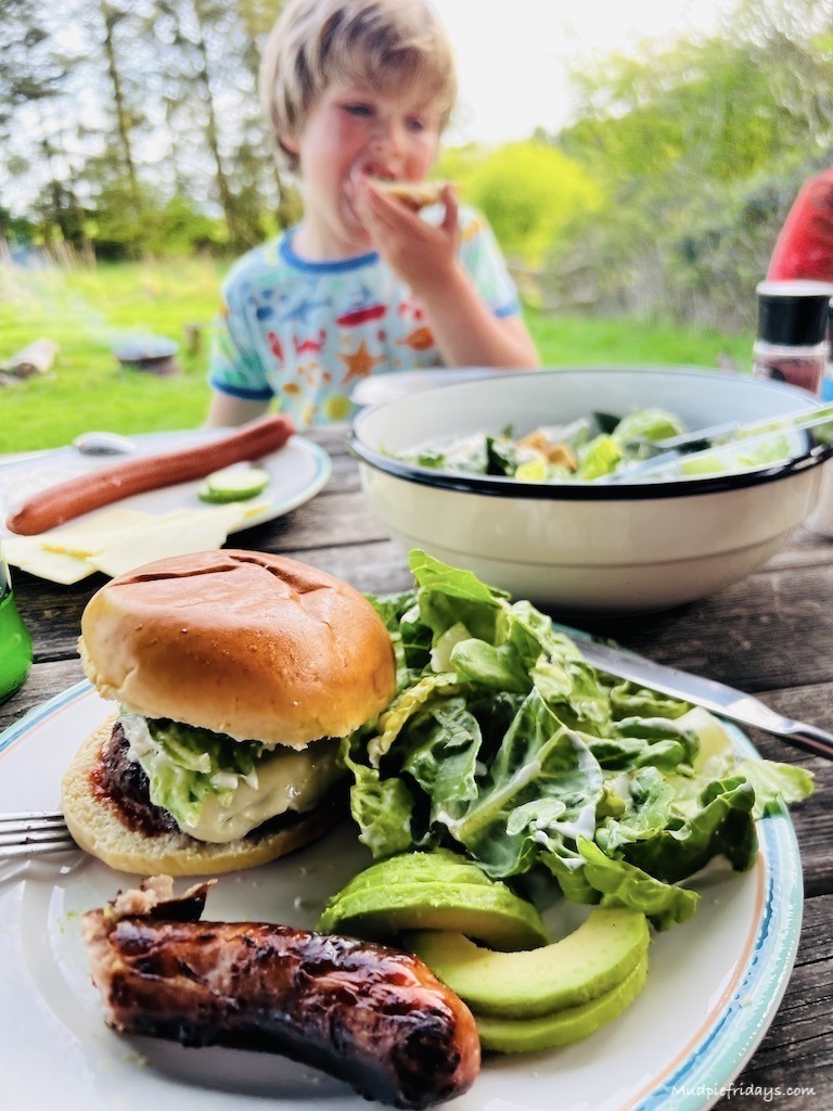 BBQ dinner with beef burgers and sausages brought on site from the honesty shop