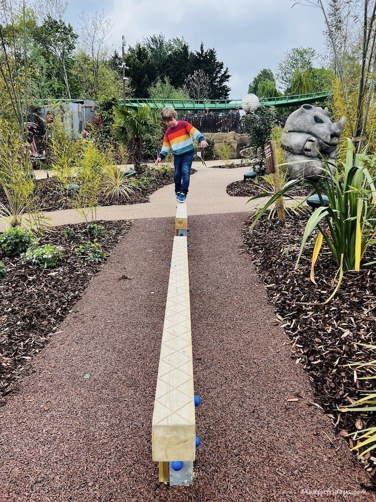 Harry balancing on some of the play area within the park