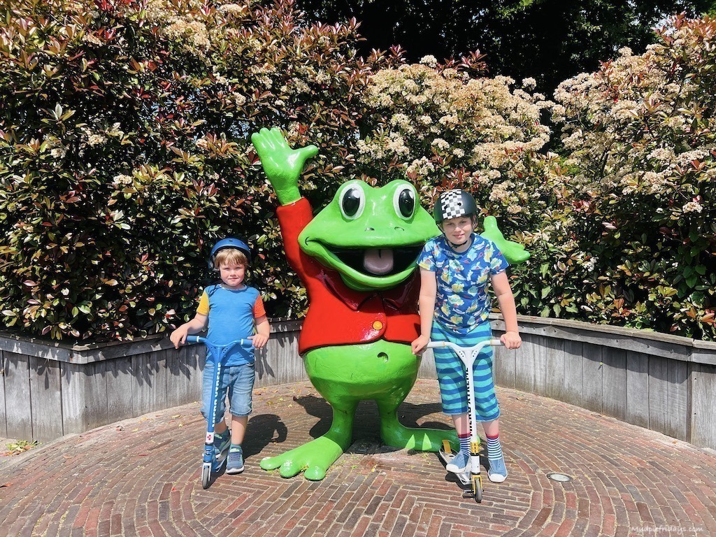 The boys in front of the entrance to Duinrell theme park and Rick the frog