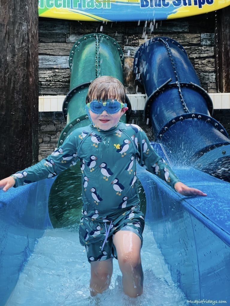 harry coming off the water slide in the Playa section of the pool complex