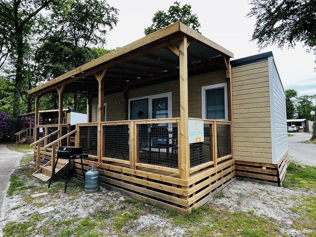 Eurocamp Duinrell Azure Lounge - 3 bedroom mobile home from the outside showing a covered deck area