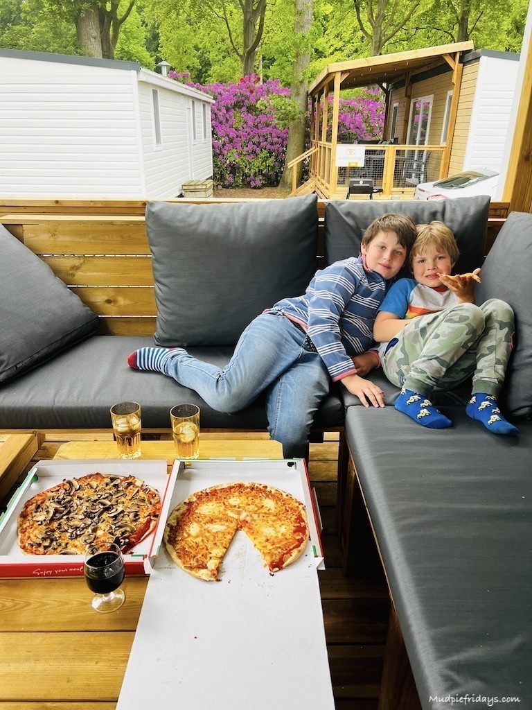 The boys sitting on the sofa at our Eurocamp Azure lounge in Durinell holiday park