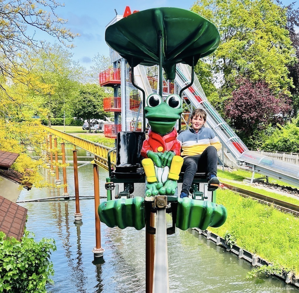 Charlie on the frog monorail. The frog is the park mascot
