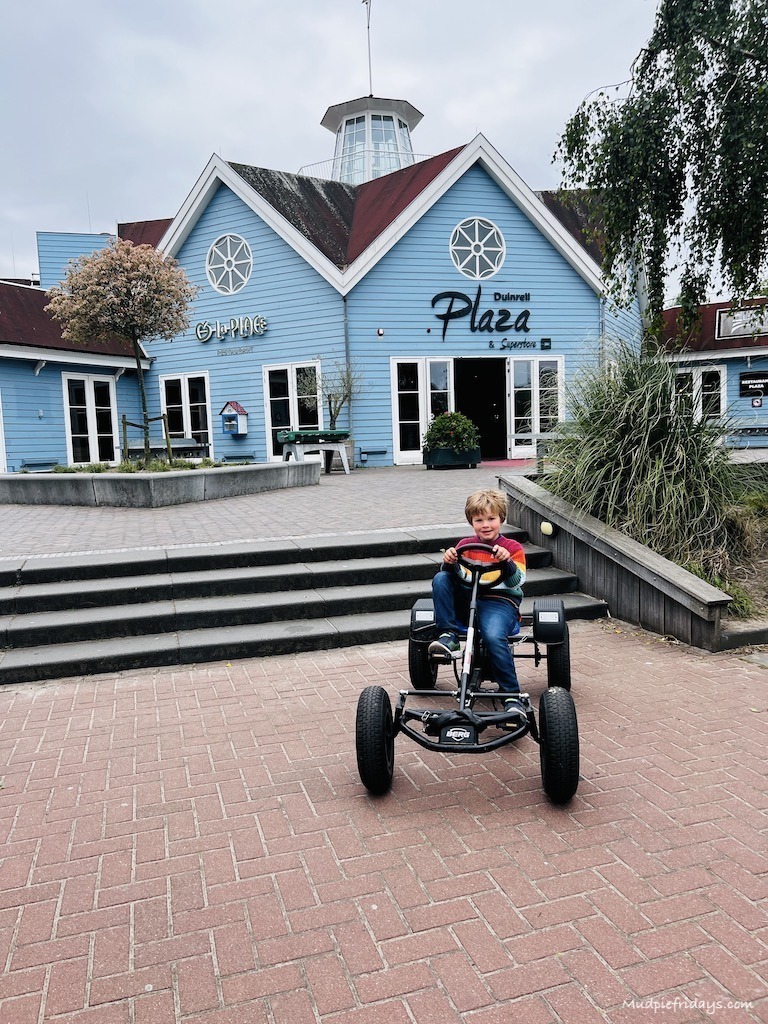 Harry on a go-kart in front of the main square