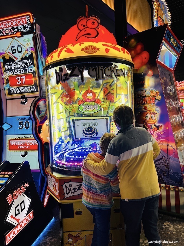 The boys trying out some of the machines in the arcade