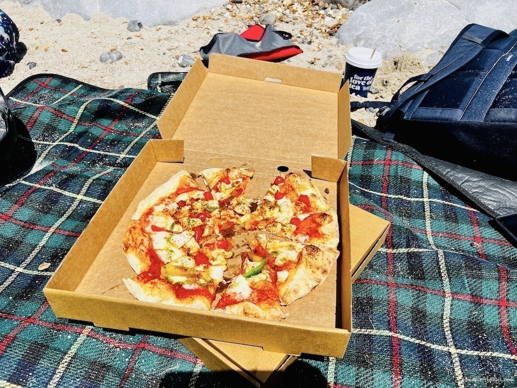 take away pizza from the Perch restaurant that we ate on the beach